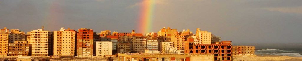 city in foreign country with rainbow in background, God's promise to his people
