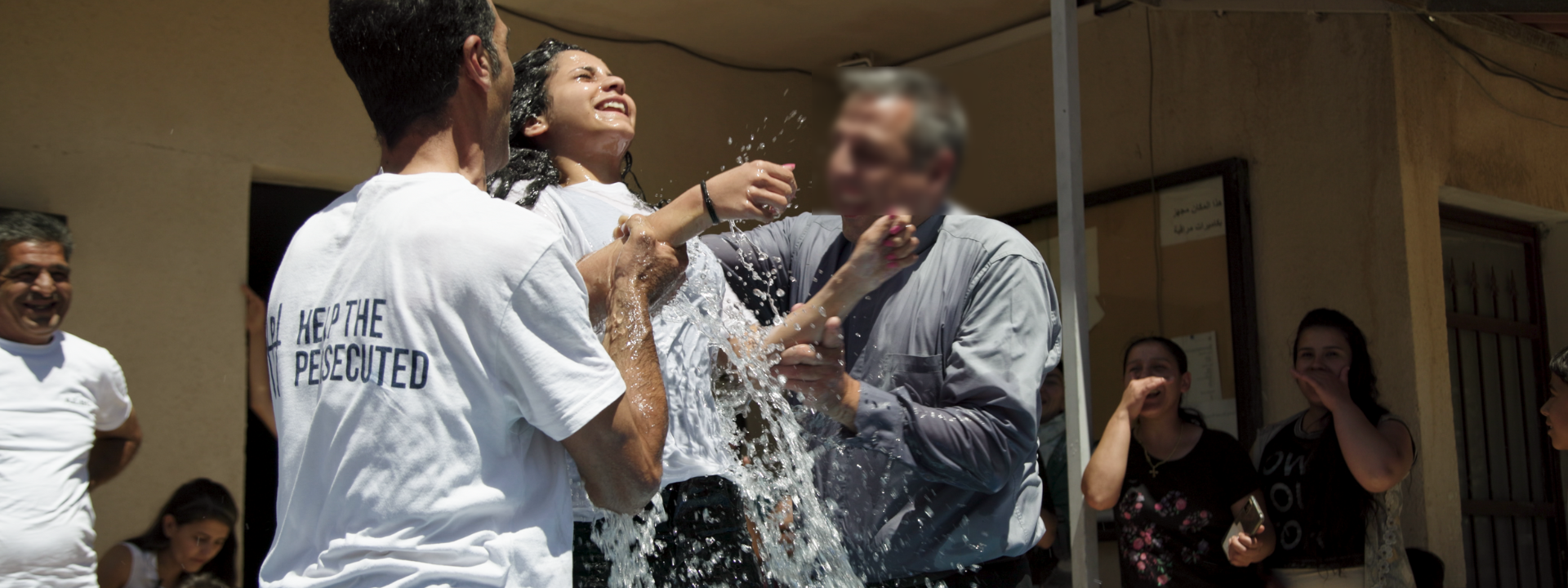 image of the baptism of a Syrian refugee from the Enduring Love ministry