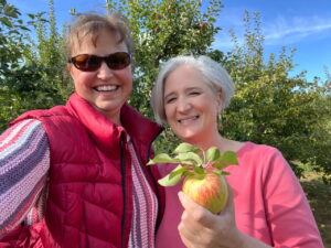Kit Ripley apple picking with a friend from Bates College